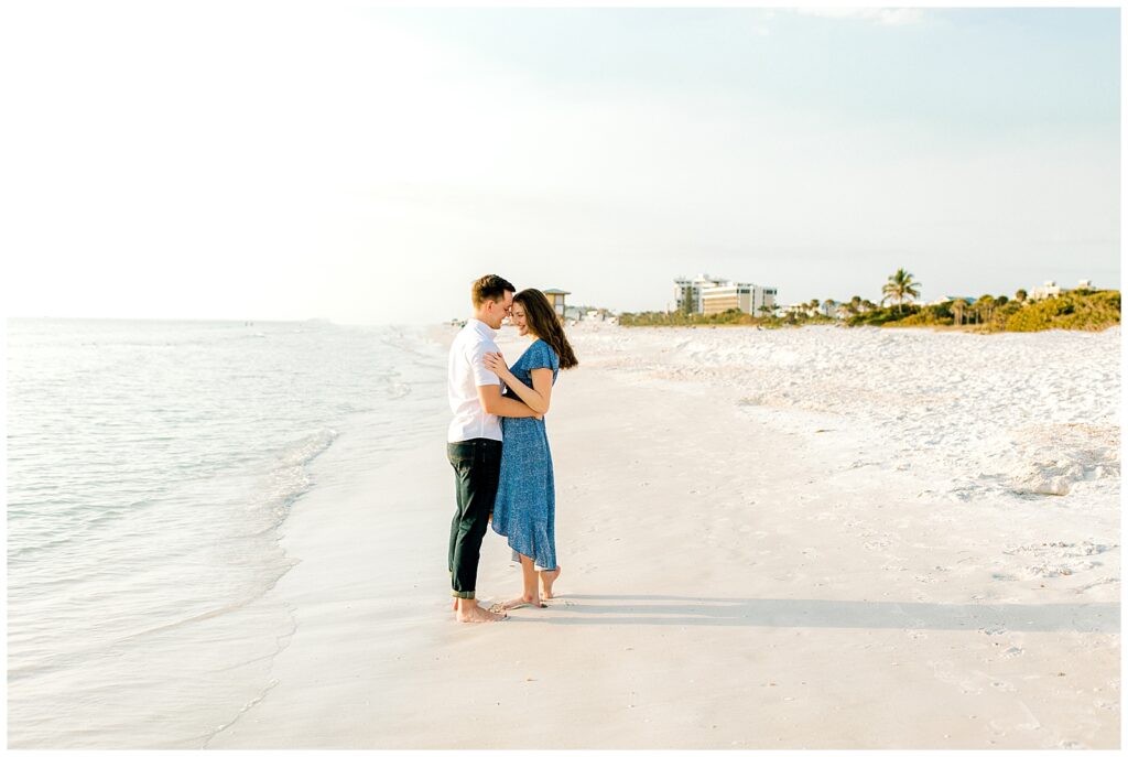 engaged couple on beach in florida